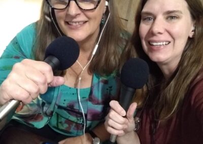 Two women holding microphones