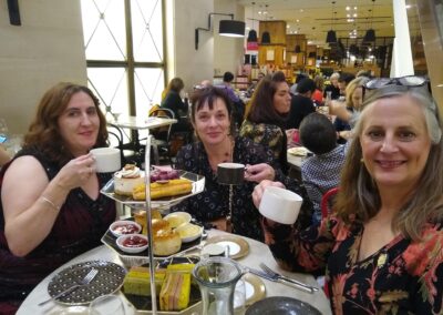 Three women drinking tea
