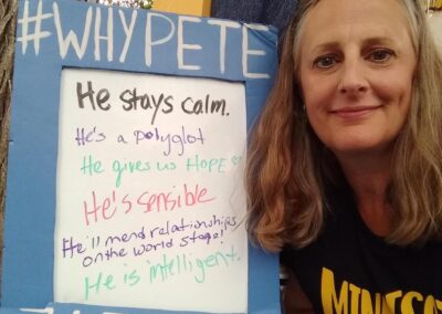 A woman with a "Why Pete?" sign