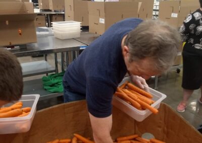 A man packing carrots